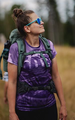 Hiker in a purple sublimated technical shirt